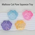 Vue macro de quatre jouets antistress en forme de patte de chat pailletée sur fond ondulé. - Style Patte de Chat (Lot de 12)