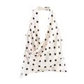 Detail view of a white polka dot halter top with silky satin texture and draped front - XS / Polka Dot