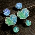 Handmade vintage heart and rose drop earrings with iridescent blue and green resin beads - 2606226 Blue Rose Heart Beaded Earrings