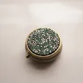 Portable round metal pill organizer box with sparkling green rhinestone lid for travel - Bronze - Silver Green Rhinestone