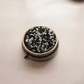 Portable round metal pill box featuring a sparkling black and silver rhinestone lid - Bronze - Silver Black Rhinestone