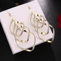 Elegant long tiered gold-tone dangle earrings with a sparkling glitter texture finish - H1046-4 Geometric Two-tone