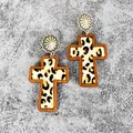 Close-up of Western style wooden cross earrings with leopard print leather inlay - Yellow Leopard(1)