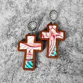 Macro view of western wooden cross earrings with engraved sunflower stud and leather. - Red Green Bohemian(10)