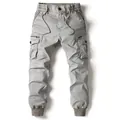 Detailed view of men's cargo joggers with drawstring elastic waist and side pockets - 38 / Ivory