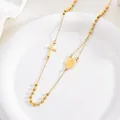 Gedetailleerde weergave van een 3mm gouden rozenkrans ketting met kruis en Maria. - Goud Maagd Maria