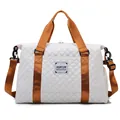 White quilted travel bag with brown straps, large capacity duffel for gym or travel - Off White