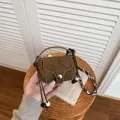 Vintage brown suede mini coin purse with adjustable crossbody strap and top handle - Brown