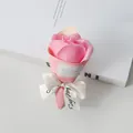 Detailed view of pink soap rose bouquet with Best Wishes label and white ribbon - Rose Pink