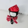 Detailed view of mini red soap rose bouquet with Best Wishes sticker and ribbon - Rose Red