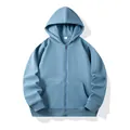 Classic solid light blue zip-up hoodie featuring a warm hood and front pockets. - Haze Blue