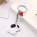 Gedetailleerd beeld van een schattige hondensleutelhanger met rood hart hangertje - Maltezer (Zwart & Wit Stijl) / 10cm