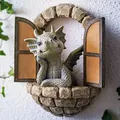 Realistic resin garden dragon statue peeking through a stone window wall decoration - Window Dragon