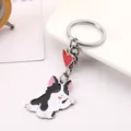 Close-up of a cute waving black and white dog keychain with a red heart pendant. - Bull Terrier (Black & White Style) / 10cm