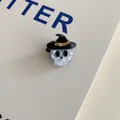 Detail of Halloween skull hair claw clip with black witch hat on textured background - Skull Wizard Hat Clip