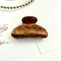 Medium tortoiseshell acrylic hair claw clip featuring elegant water ripple pattern - Brown