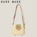 Woven straw crossbody bag with colorful beaded flap and brown strap - Beige