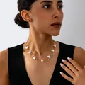 Elegante collar de perlas barrocas de mariposa con anillos dorados, estilo sencillo - Mariposa