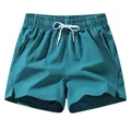 Herren Schnelltrocknende Eisseide Sportshorts in Türkis mit Kordelzug für Fitness - S / Seeblau