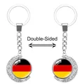 Llavero de luna creciente giratoria con cabujón de cristal bandera alemana doble cara - Bandera de Alemania (62438528)