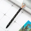 Elegant black ballpoint pen featuring rose gold dots and a large faux diamond top ornament. - Black with Rose Gold Polka Dots / 1.0mm Bullet Tip