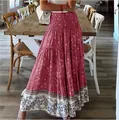 Detail view of bohemian floral print high waist maxi skirt for summer beach vacation - Red