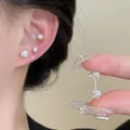 Primo piano di orecchini a lobo in argento s925 con zirconi brillanti. - 5mm / Sfera Zirconia Barbell Singolo (Imballaggio Sfuso)
