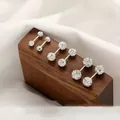 Primo piano di diverse dimensioni di orecchini a bilanciere in argento e zirconi - 6mm / Sfera Zirconia Barbell Singolo (Imballaggio Sfuso)