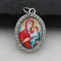 Detailed view of oval silver-tone pendant featuring Virgin Mary and Child with rhinestones - Silver Virgin Mary Holding Infant Style (DZJFT001) / Silver Color Red