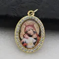 Detailed macro shot of an oval gold-plated pendant with religious icon and rhinestones - Gold Classic Religious Art Style (DZJFT001) / Gold Red Variant 7