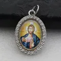 Detailed view of an oval pendant featuring a religious icon framed with rhinestones - Silver Jesus Christ Style (DZJFT001) / Blue Variant 3