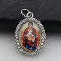 Detail view of an oval religious icon pendant with sparkling micro-pave crystals. - Silver Religious Icon Pattern Style (DZJFT001) / Silver Red Variant 2