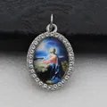 Detailed close-up of oval micro-pave religious pendant with sparkling rhinestones. - Silver Jesus Praying Style (DZJFT001) / Blue Variant 1
