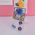 Transparent acrylic phone stand with cute cartoon astronaut design for office desk - Astronaut Style 1
