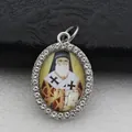 Close-up macro view of an oval religious saint pendant with shiny rhinestone border. - Silver Religious Saint Portrait Style (DZJFT001) / Coffee Silver Variant 1