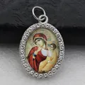 Detailed view of oval micro-pave pendant featuring religious icon with rhinestones - Silver Printed Madonna and Child Icon Style (DZJFT001) / Silver Red Variant 5