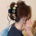 Grande pinza per capelli nera decorata con simpatici ciondoli colorati a forma di dessert - Fermaglio a Pinza Grande Design Ciambella