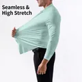 Men's high elasticity mint green long sleeve dress shirt showing the stretchable fabric - XS / Tops / Light Green