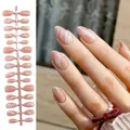 Elegant nude almond press-on nails with white wavy marble pattern and subtle glitter - Nude Wave Pattern