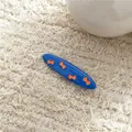 Cute blue oval hair clip with orange bow patterns on a soft beige textured background - Bow Style Duckbill Clip (J174-B16) / Dark Blue