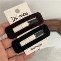 Pair of elegant velvet rectangular hair clips in black and dark brown. - Rectangular Snap Clip (Pair) / Black and Coffee