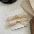 Elegant beige velvet bow hair clips with gold metal center for women's hair accessories - Bowknot Gold Bead Pair / Beige