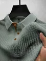 Close-up view of breathable ice silk mesh fabric on a men's polo shirt collar. - Army Green