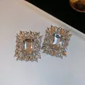 Exquisite rectangular cubic zirconia stud earrings with a brilliant silver-tone finish - Silver Earring Post Earrings / Silver