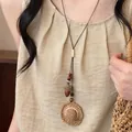 Vintage Maillard style long necklace featuring a woven straw hat and acorn pendant - Coffee - Woven Straw Hat Style