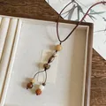 Vintage Maillard style long necklace with geometric wood and resin beads on brown cord. - Coffee & White Bodhi