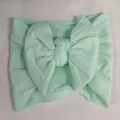 Bandeau élastique pour bébé en jacquard vert menthe avec un grand nœud décoratif. - Vert Menthe (43)