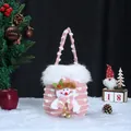 Handmade pink knitted Christmas snowman gift bag featuring fuzzy white trim and golden bells - Knitted Snowflake Velvet Snowman Bag