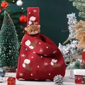 Red knitted Christmas gift bag featuring reindeer charm and snowflake patterns for kids - Red Knit Bag with Elk Doll