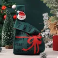 Festive green knitted Christmas gift bag with Santa Claus decoration and a red bow - Green Knit Bag with Santa Doll